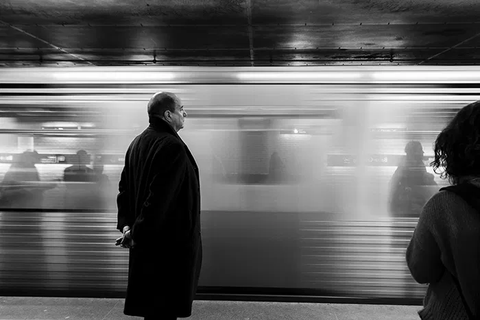 motion blur man waiting for train in subway